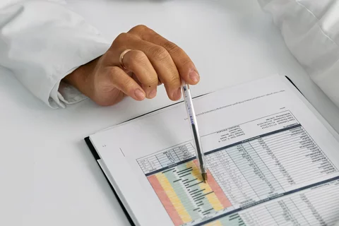A doctor reviewing a chart